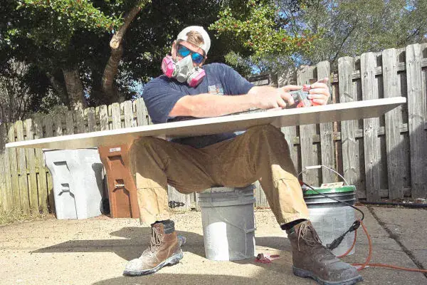 Austin Wiggins, founder of Platinum Global Painting, on a Pensacola job site
